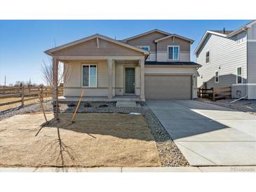 Charming two-story home with a front porch and a two-car garage at 5918 Red Barn Ave, Mead, CO 80504