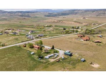 Sweeping aerial view of the rural property with picturesque mountain views and serene surroundings at 6310 W County Road 4, Berthoud, CO 80513