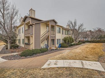 This home boasts a two story floor plan with an outdoor patio and beautiful landscape at 5455 S Dover St # 101, Littleton, CO 80123