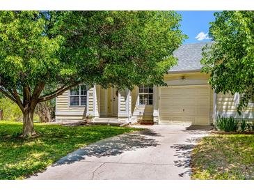 Charming single-Gathering home with mature trees and a well-manicured lawn at 3962 Hoyt Ct, Wheat Ridge, CO 80033