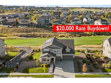 Beautiful two-story home with a manicured lawn and a $20,000 Rate Buydown offer at 8075 S Vandriver Way, Aurora, CO 80016