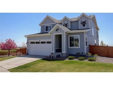 Charming two-story home featuring a well-manicured lawn and attached two-car garage at 542 W 173Rd Ave, Broomfield, CO 80023