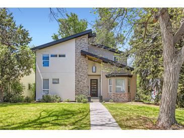 Striking contemporary home with manicured lawn and modern architectural details at 1533 S Columbine St, Denver, CO 80210