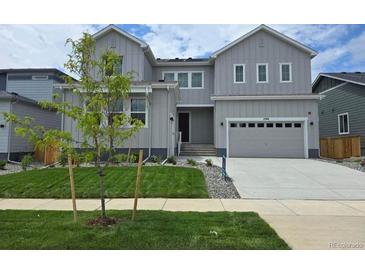 Charming two-story home with a well-manicured lawn and attached two car garage at 2548 Lupton Ln, Lafayette, CO 80026