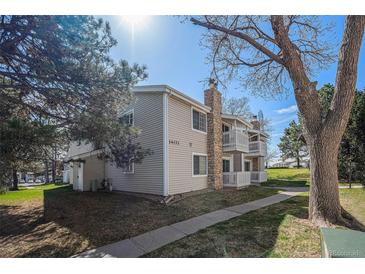 Charming townhouse featuring a stone chimney and private balcony at 14171 E Jewell Ave # 203, Aurora, CO 80012