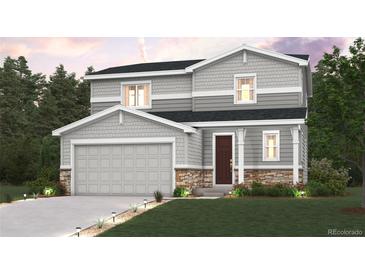 Charming two-story home features a two-car garage, neutral color palette, and stone accents at 42724 Calusa Pines Rd, Elizabeth, CO 80107