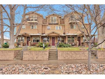 Attractive townhome exteriors with covered patios and stone accents in a well-maintained community at 2686 S Cherokee St, Denver, CO 80223