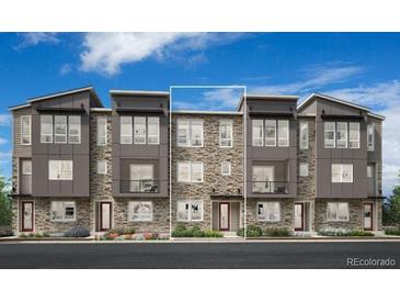 Modern townhome with stone accents and a welcoming entrance, set against a blue sky at 6285 N Kirk St, Aurora, CO 80019