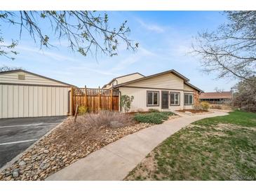 Charming home with a well-maintained exterior, walkway, and landscaping at 16086 E Ithaca Pl # D, Aurora, CO 80013