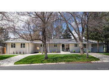 Stunning single story exterior featuring a well maintained lawn and mature trees in front at 3901 S Dexter St, Cherry Hills Village, CO 80113