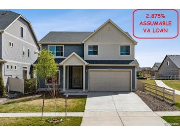 Charming two-story home with a two car garage, mature landscaping, and assumable VA loan at 5352 Truckee St, Denver, CO 80249