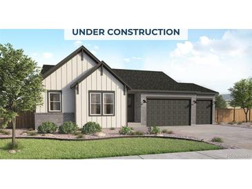 Charming two-story home with modern farmhouse architecture, three-car garage, and professionally landscaped front yard at 400 Clear Bell Ln, Monument, CO 80132