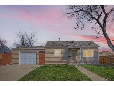 Charming single-story home featuring a well-maintained lawn and detached garage, perfect for first-time homebuyers at 1480 S Osceola St, Denver, CO 80219