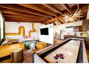 Bright open concept living and kitchen with unique decor and layout at 7991 Stuart St, Westminster, CO 80030