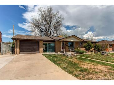 Charming brick ranch-style home with attached garage, well-maintained lawn, and mature trees at 2785 Skyline Dr, Westminster, CO 80030