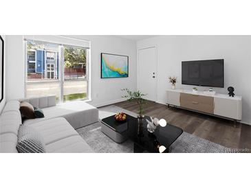 Bright living room features modern decor, sleek furniture, and hardwood floors at 7220 S Gaylord St # G17, Littleton, CO 80122