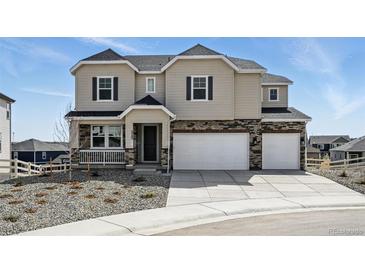 Charming two-story home with a three-car garage and manicured front yard at 5722 Farrier Pt, Castle Rock, CO 80104