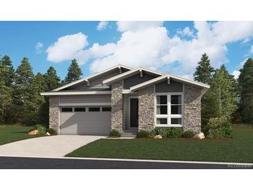 Craftsman style single-Gathering home boasts stone and gray siding, complemented by an attached two-car garage at 4601 Thistle Dr, Brighton, CO 80601