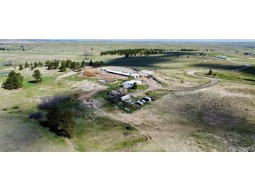 Scenic aerial view of the property featuring rolling hills and lush green trees at 1740 Michael Gates Dr, Parker, CO 80138