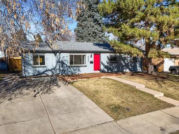 Charming single-story home featuring a red front door, a well-maintained lawn, and a mature tree at 2237 S Lowell Blvd, Denver, CO 80219