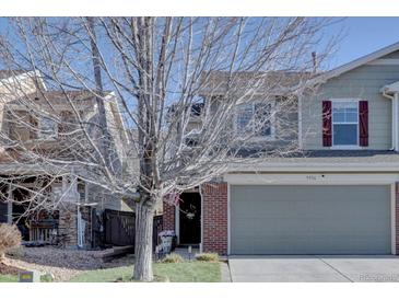Charming two-story home with a two-car garage and a brick entryway at 5936 Turnstone Pl, Castle Rock, CO 80104