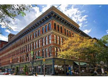 Brick building exterior on a sunny day with blue sky at 16th Street Mall in Denver, Colorado at 1555 California St # 603, Denver, CO 80202