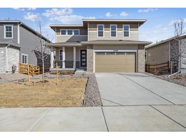 Modern two-story home with a two-car garage and neutral toned color palette at 24769 E 39Th Ave, Aurora, CO 80019