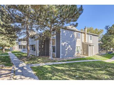 Charming condo featuring stone accents and a welcoming balcony at 18193 E Kentucky Ave # 204, Aurora, CO 80017