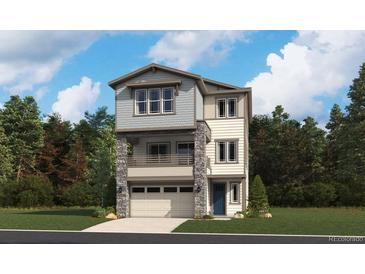 Two-story modern home with attached garage and balcony at 8516 Eagle River St, Littleton, CO 80125