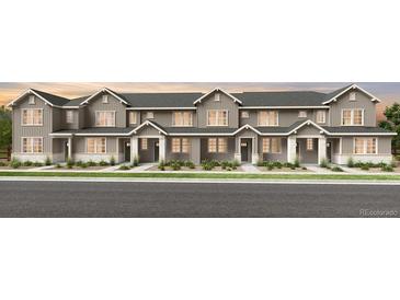 Charming townhome showcasing classic architectural details and inviting curb appeal at 17164 W 91St Ln, Arvada, CO 80007