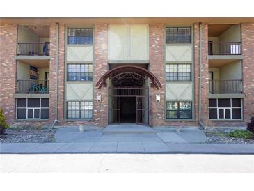 Attractive brick exterior of the building with balconies and gated entrance at 1021 Carr St # 17, Lakewood, CO 80214