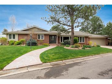Charming one-story brick home with a well-manicured lawn, mature trees, and a welcoming stone walkway at 5164 E Princeton Ave, Cherry Hills Village, CO 80113