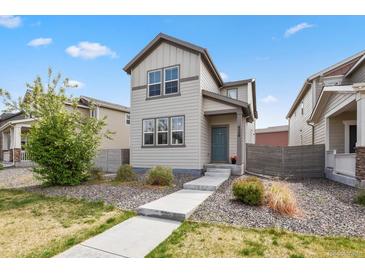 Charming two-story home with landscaped front yard and modern neutral color scheme at 4770 N Jasper St, Denver, CO 80239