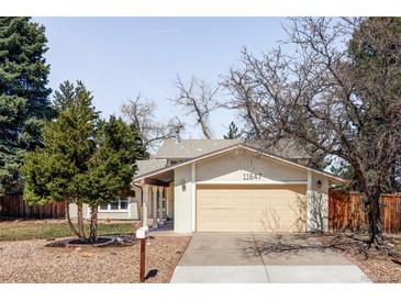 Charming single-Gathering home featuring a two-car garage and well-maintained landscaping at 11647 E Wesley Ave, Aurora, CO 80014