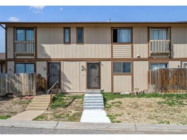Charming townhome featuring a secure front door entry and inviting curb appeal at 2567 Rainbow Dr # 80, Denver, CO 80229