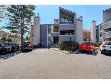 View of the apartment complex exterior showcasing its architecture and parking area at 6490 S Dayton St # L10, Englewood, CO 80111