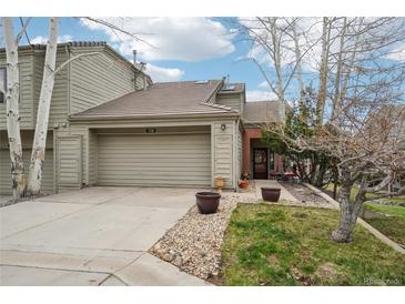 Charming home featuring a two-car garage, neutral exterior, and manicured landscaping at 758 Chimney Creek Dr # C, Golden, CO 80401