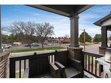 View of the balcony area showcasing outdoor seating furniture and a barbecue grill at 1312 Independence St # 3, Lakewood, CO 80215