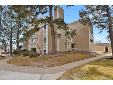 Charming multi-story condo featuring a chimney and attractive facade at 3872 S Fraser St # O03, Aurora, CO 80014