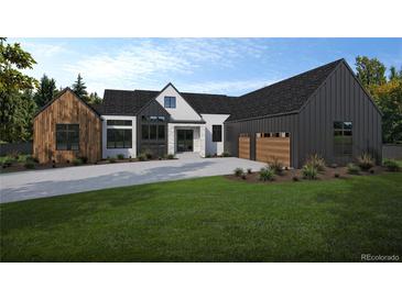 Striking modern farmhouse with a harmonious blend of textures, a spacious garage, and manicured lawn at 5316 Flora Way, Arvada, CO 80004