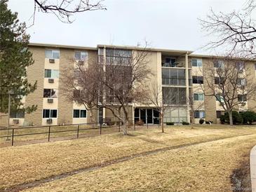 Apartment exterior showcasing well-maintained landscaping and common areas at 3124 S Wheeling Way # 102, Aurora, CO 80014