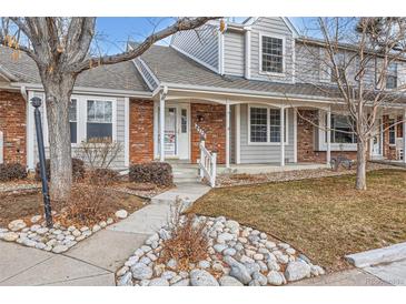 Inviting exterior of townhome with landscaping and walkway at 6712 E Briarwood Dr, Centennial, CO 80112