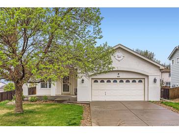 Charming home featuring an attached two-car garage and a well-maintained front lawn at 12507 Dexter Way, Thornton, CO 80241