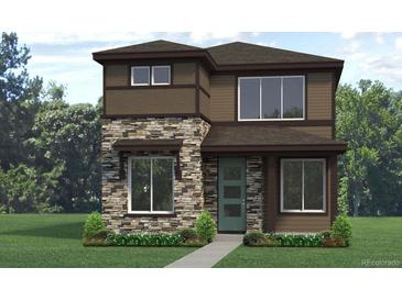 Charming two-story home features a stone facade, large windows, manicured lawn and a modern, green front door at 2769 Milagro Dr, Brighton, CO 80601