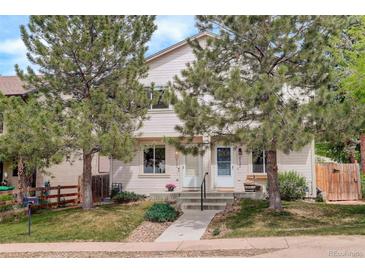 Inviting exterior view of a two-story home with a well-manicured lawn and mature trees at 4720 S Bannock St, Englewood, CO 80110