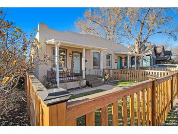 Charming craftsman bungalow with a fenced front yard at 3403 N Raleigh St, Denver, CO 80212