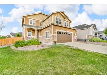 Charming two-story home with a well-manicured lawn and attached two car garage at 3762 White Rose Loop, Castle Rock, CO 80108