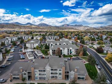 Aerial view of a community with mountain views and spacious grounds at 12093 W Cross Dr # 206, Littleton, CO 80127