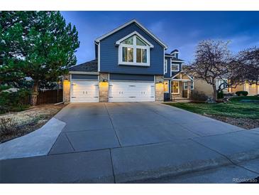 Charming two-story home with a three-car garage and a beautifully landscaped front yard, perfect for families at 13076 Marion Dr, Thornton, CO 80241