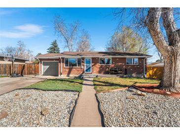 Charming brick home with a well-maintained front yard and inviting entrance at 3395 W Union Ave, Englewood, CO 80110